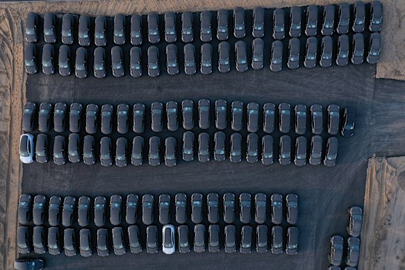 Brand-new vehicles ranked up outside Tesla’s German gigafactory.