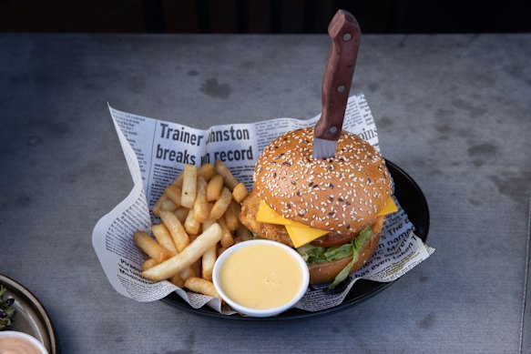 Chicken tenderloins coated in a Dorito spice blend, fried golden, with lettuce, guacamole, tomato, jalapenos, American cheddar and a creamy buffalo sauce with chips and side of cheese sauce. 
