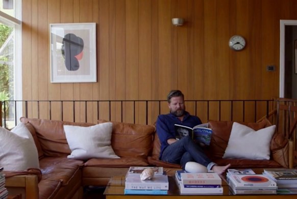 Tim Ross inside his modernist home in Sydney.