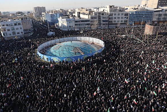 People gather in mourning after state TV officially announced the death of Iranian Supreme Leader Ayatollah Ali Khamenei, in Tehran on Sunday.