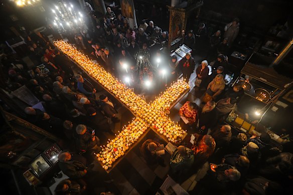 Believers attend an Orthodox service for the “sanctification of honey,” at the Presentation of the Blessed Virgin Church in the town of Blagoevgrad, Bulgaria, marking the feast day of St. Haralambos, the Orthodox patron saint of beekeepers.