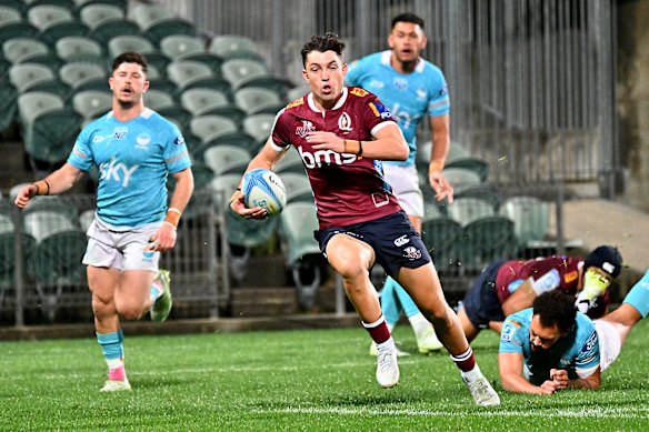 Jock Campbell of the Reds scores a try during the round 15 Super Rugby match against Moana Pasifika at North Harbour Stadium.