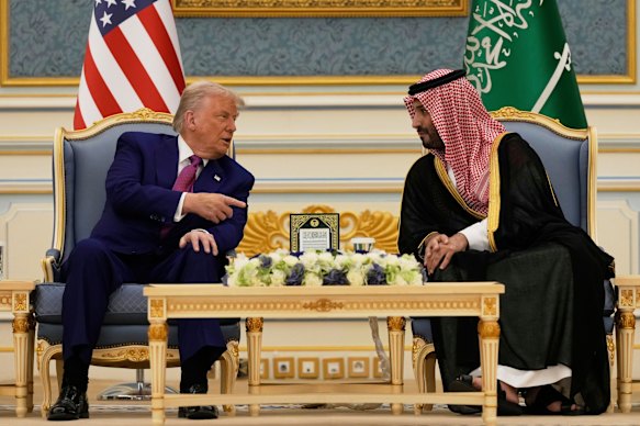 Trump and MbS speak during a meeting at the Royal Palace.