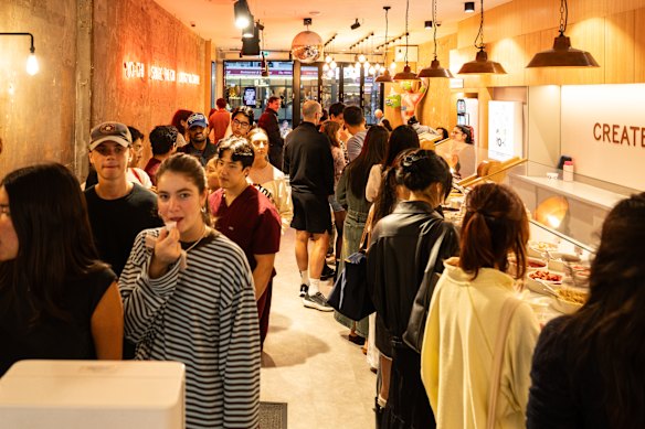 Customers queuing at a Yochi frozen yoghurt store