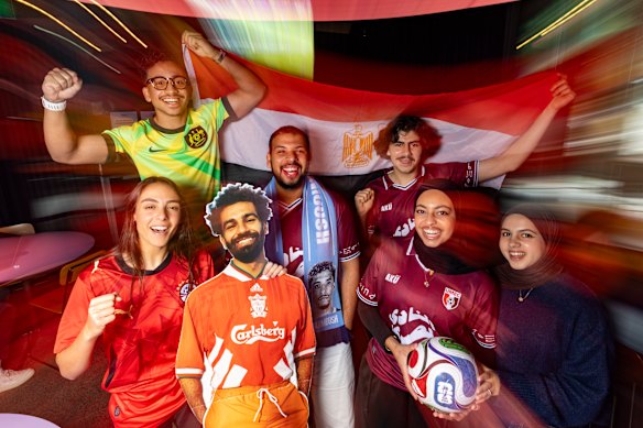  L-R University of Melbourne Egyptian Club members Amira Marwan with a cardboard cut-out of player Mo Salah, Essam Altayyar, Mohamed Orabi, Ryan Rud, Mariam El Meligi and Lujain Aldawood.