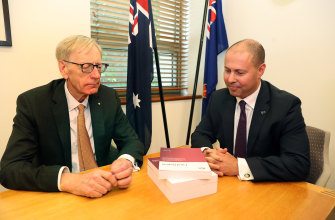 There wasn't a lot of conversation when banking royal commissioner Kenneth Hayne (left) delivered his final report to Treasurer Josh Frydenberg. 