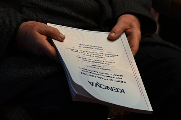 A relative of a victim holds a copy of the Kenova report.
