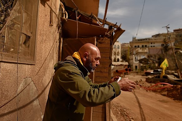 Mohammad Moussawi at the site of the airstrike where his son and nephew were buried under the rubble.