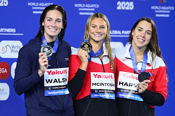 Canada’s Summer McIntosh (centre) celebrates her gold medal in the women’s 200m individual medley at the world swimming championships in Singapore. 