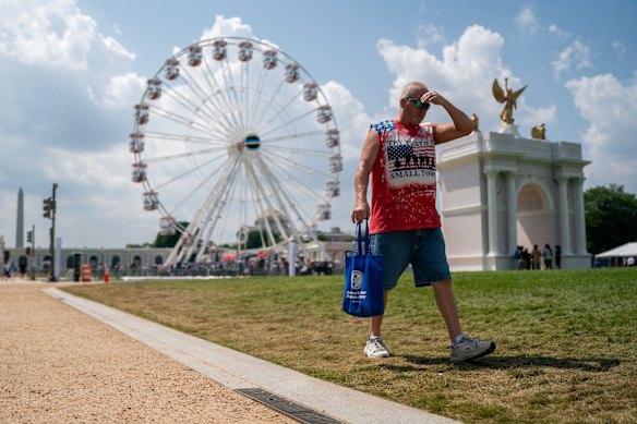 A visitor reacts to the heat at the Great American State Fair on the National Mall on Wednesday.
