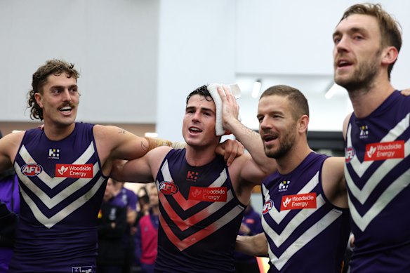 Luke Jackson, Andrew Brayshaw, Sam Switkowski and Oscar McDonald sing the Fremantle song after a crucial win.