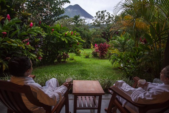 Sharing tea and volcano views beyond the garden.