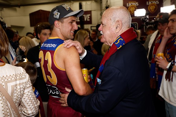 Former Lions coach Leigh Matthews congratulates forward Zac Bailey after last year’s grand final win.