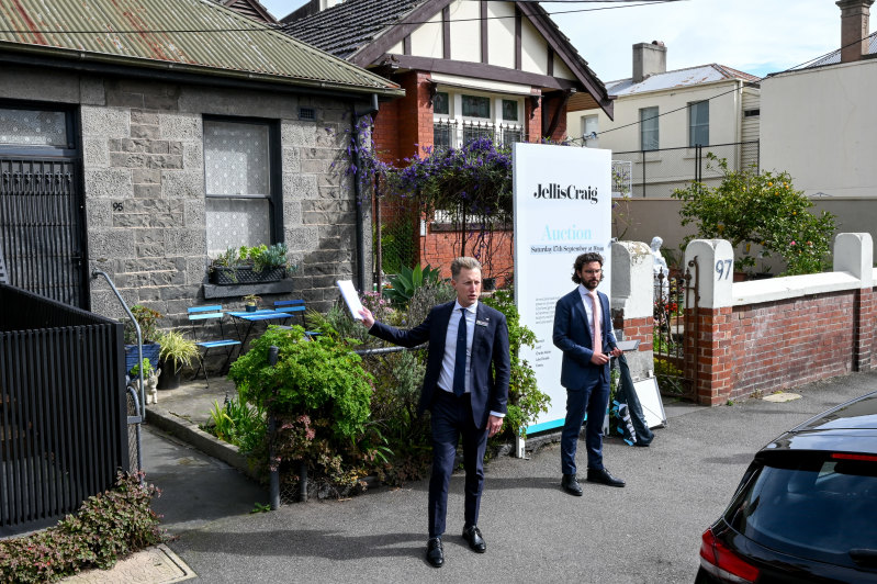 Jellis Craig Fitzroy partner and auctioneer Charles Atkins asks for buyers for their best offers during the auction for the terrace.