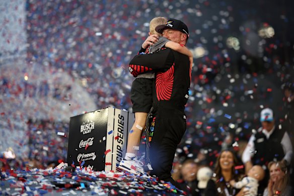 Tyler Reddick, driver of the #45 Chumba Casino Toyota, and son, Beau Reddick celebrate in victory lane after winning the NASCAR Cup Series Daytona 500 at Daytona International Speedway on February 15, 2026 in Daytona Beach, Florida. 