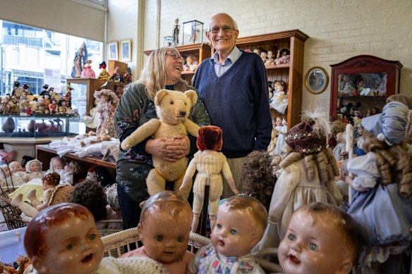 Volunteer Sara Blake with Doll Hospital owner Charles Phillip. The hospital is closing after more than 140 years. 