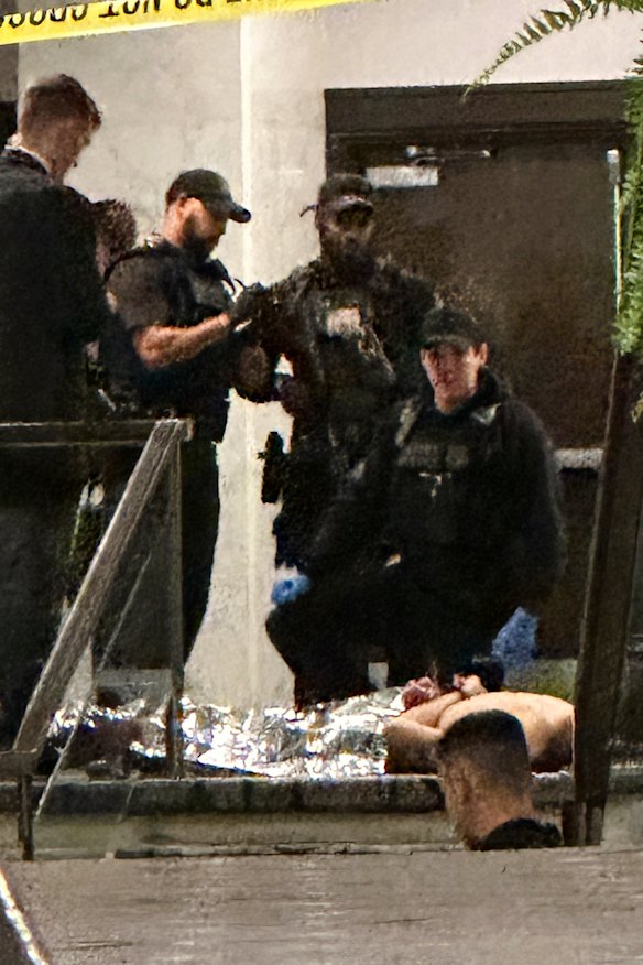 A person in custody after shots were fired in the lobby of the Washington Hilton hotel.