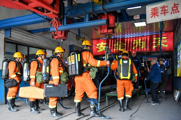 Rescue workers prepare to descend into the coal mine that was the scene of a deadly explosion.