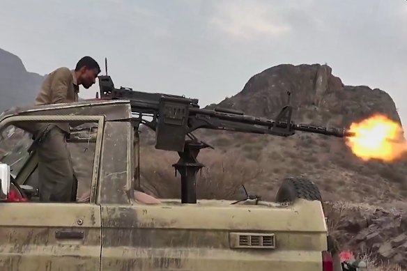 This image taken from undated video released by the media arm of Yemen’s Houthi rebels on September 22, shows what the group says is a Houthi fighter firing a vehicle-mounted machine gun at Saudi-backed forces in Yemen.