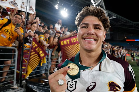Reece Walsh celebrates his Clive Churchill Medal win after Sunday’s grand final.