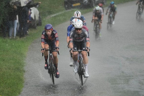 Groves (centre) navigates the wet conditions on Saturday.