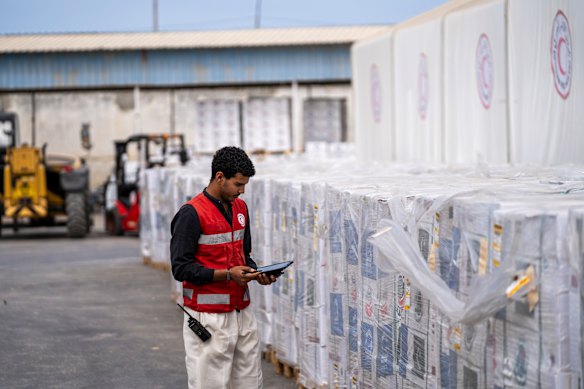 A member of the Egyptian Red Crescent inside the aid warehouse in Al-Arish, near the Rafah crossing between Egypt and Gaza, on Thursday.