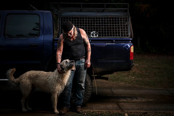 Bikie Stephen Mallet and his dog Tucker in Bright. His property was raided by police not long after Dezi Freeman killed two police officers in Porepunkah. 