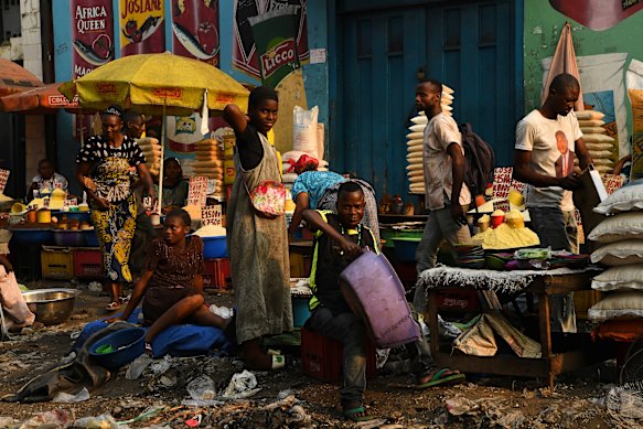 Stallholders at a street market in Kinshasa in the Democratic Republic of Congo, after general elections had been delayed following unrest in 2018.
