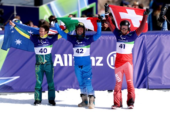 Ben Tudhope celebrates winning the bronze medal in the snowboard men’s banked slalom SB-LL2.
