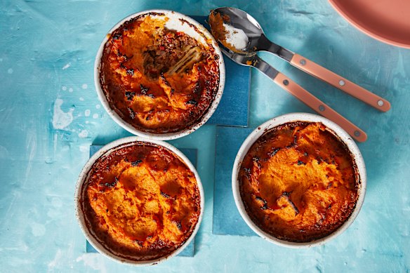 Top vegie-loaded bolognese sauce with sweet potato mash to make satisfying pies.