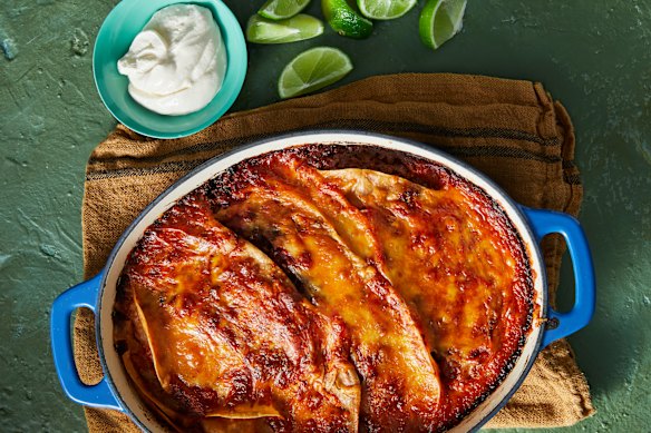 Tortillas, spices and bubbling cheese turn vegie-loaded bolognese sauce into this Mexi-spice tray bake.