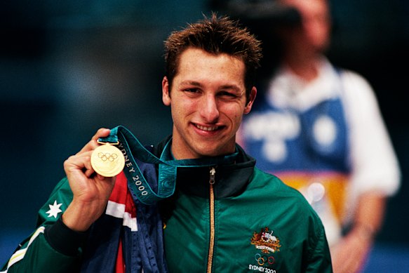 Australia’s Ian Thorpe shows off his gold medal following the men’s 400-metre freestyle swimming event at the Sydney 2000 Olympic Games. 