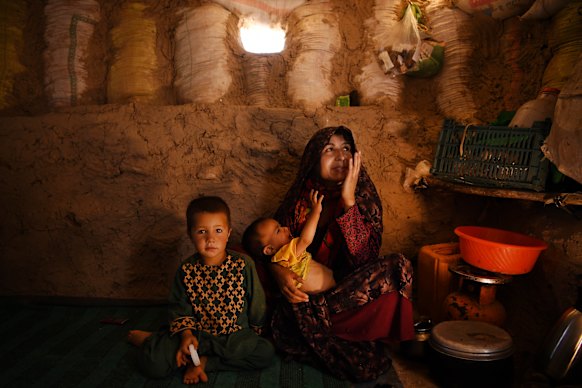 Ziba, 21, with sons Ahmed and 18-month-old Suleiman, who was suffering from malnourishment, in a camp for displaced people in Afghanistan in 2019, after their village suffered drought then floods.