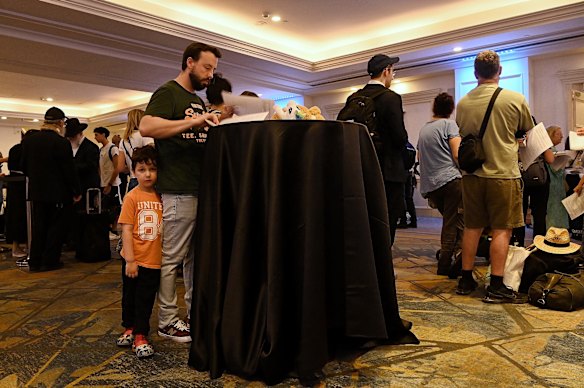 Australian citizens gather at an evacuation point in Tel Aviv.