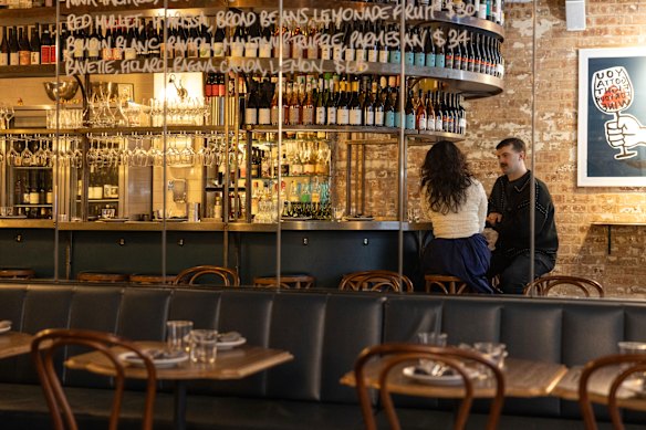 Cafe Paci’s central curved bar, where guests can sit for dinner or drinks.