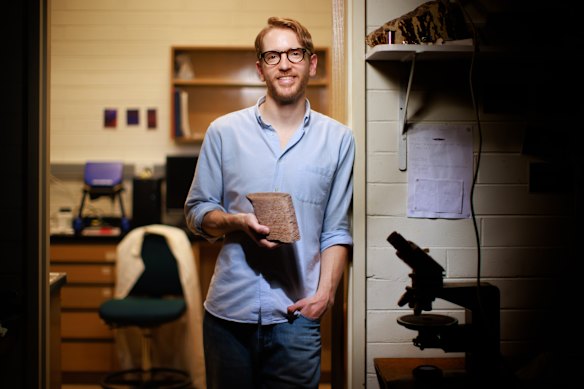 Dr Maxwell Lechte has unearthed evidence for the most ancient complex organisms on Earth - humanity’s most ancient and fundamental ancestors - from rocks in the Northern Territory. Pictured with a rock showing accumulations of seafloor bacteria approx 1.5 billion years old - stromatolite.