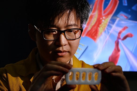 University of Sydney researcher Charles Zhao with his patented chip that can help doctors predict and treat stroke. 