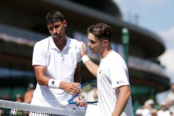 Arthur Fery greets Alexei Popyrin at the net following his victory.