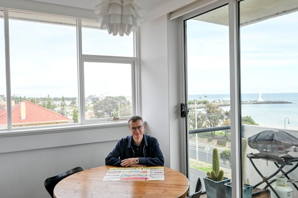Russell Jessop at his dining table in Edgewater Towers.