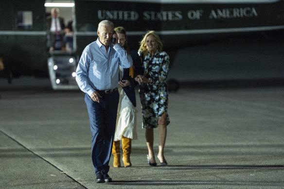President Joe Biden, left, talks connected  the telephone  arsenic  helium  walks to committee  Air Force One astatine  McGuire Air Force Base connected  Saturday.