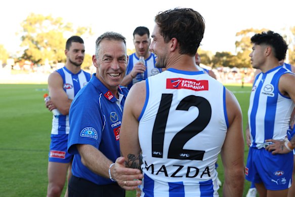 Clarkson shares a laugh with Jy Simpkin at a Roos away game in Bunbury last season.