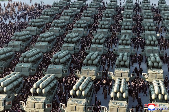 A North Korean government image shows soldiers assembled with short-range, nuclear capable missiles.