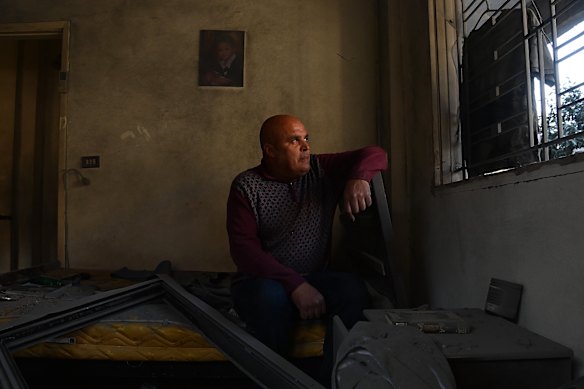 Zaher al Nassar in his damaged home. Local authorities are still searching for his neighbour, whose house was destroyed in an airstrike.