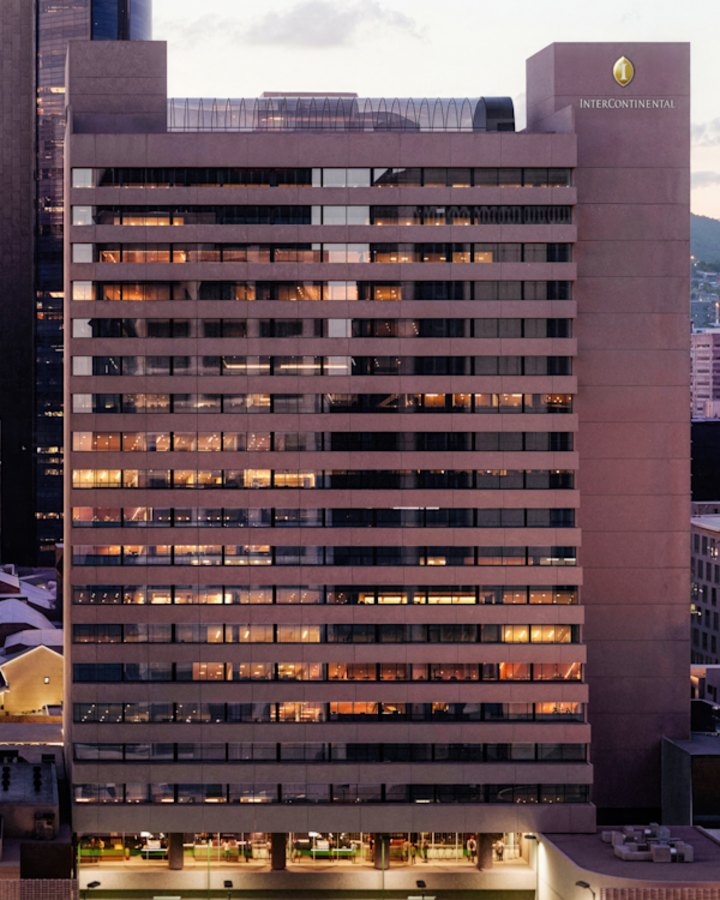 A render of the Harry Seidler-designed Hilton Brisbane building at 190 Elizabeth Street building in the CBD, which will reopen in July as an Intercontinental Hotel and will then undertake an extensive two-year refurbishment. 