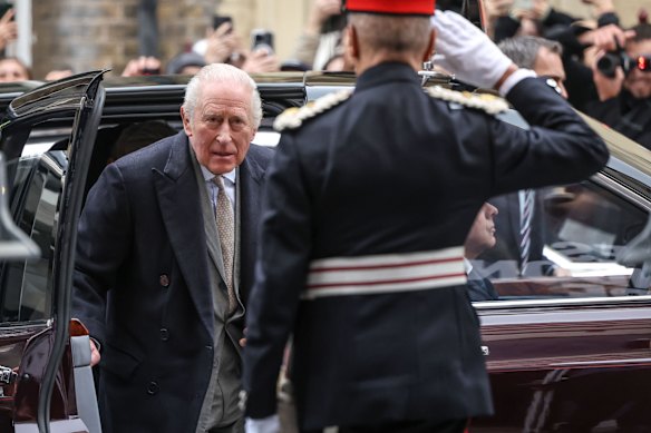 Charles arrives at the fashion show to a huge media scrum.