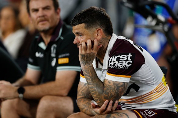 Adam Reynolds looks on from the bench after being injured in the grand final. Brisbane were lucky to hang on with a reshuffled backline.
