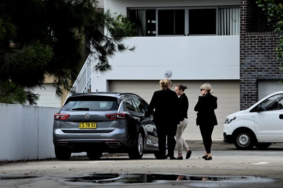 Police officers near the building where Steven Cho was killed in Baulkham Hills .
