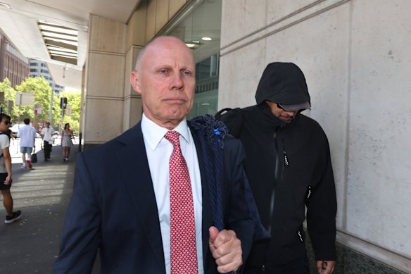 Phillip See (right) hides behind his lawyer following the NSW District Court sentence in January.