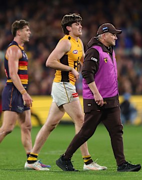 Will Day hobbles off Adelaide Oval with cramp.