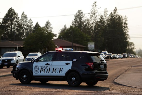 Police block the road into an evacuation area in Spokane.